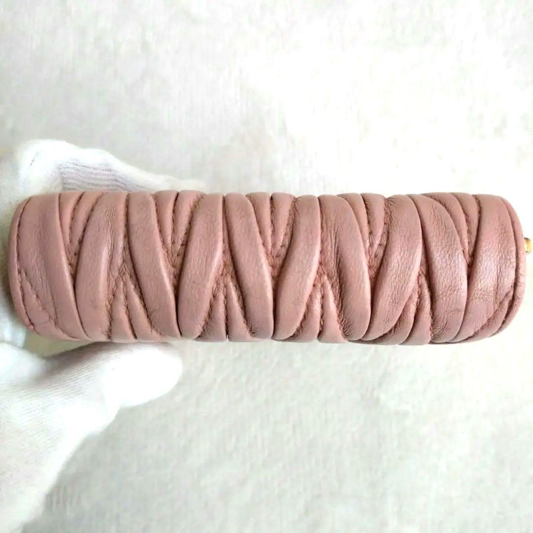 MIUMIU マテラッセ コンパクトウォレットゴールドロゴ ピンク