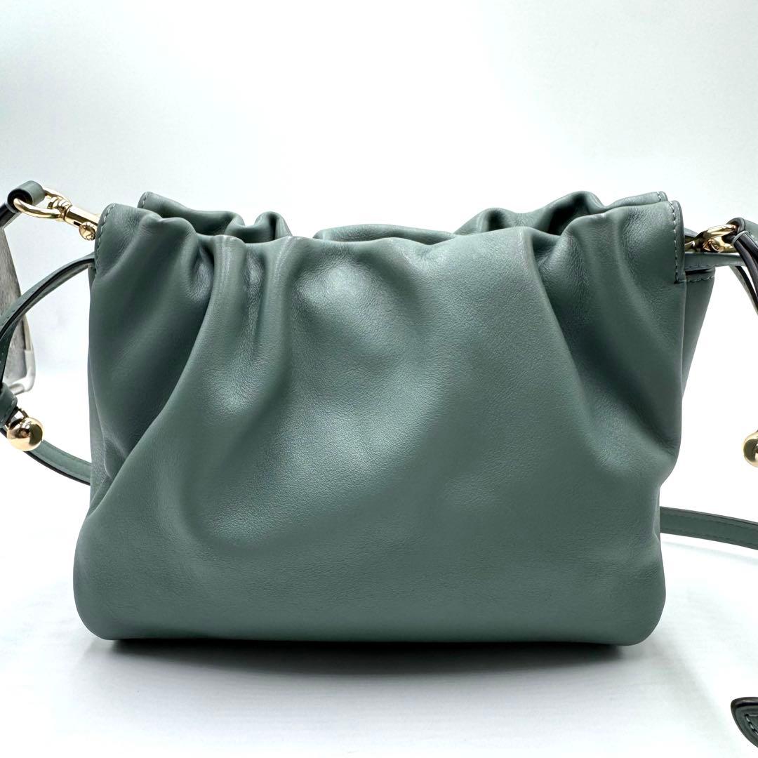 美品✨ コーチ フェイ ドローストリングバッグ レザー 巾着 ゴールド金具 水色