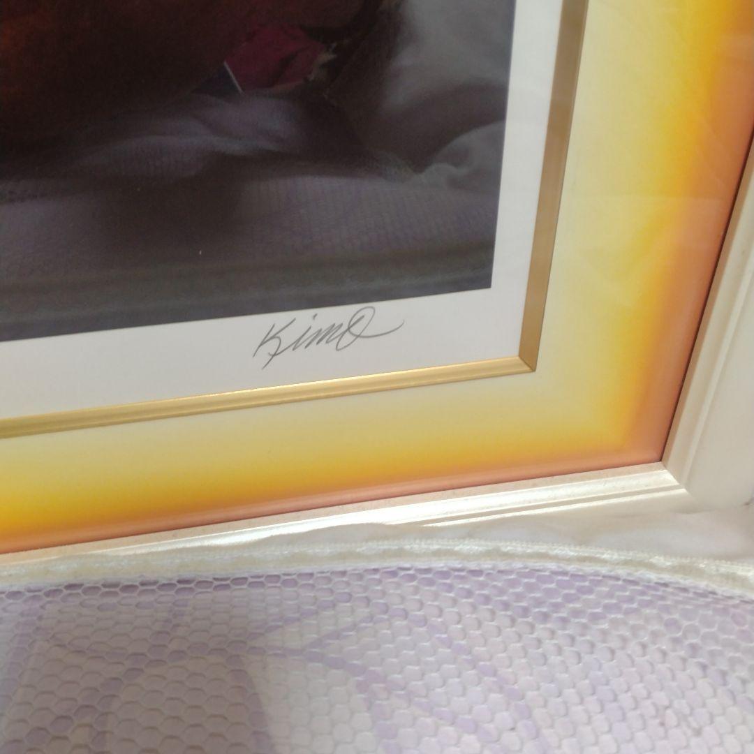 題名夕焼けの海、作者 Kim 、版画Ｎｏ．8/100です。