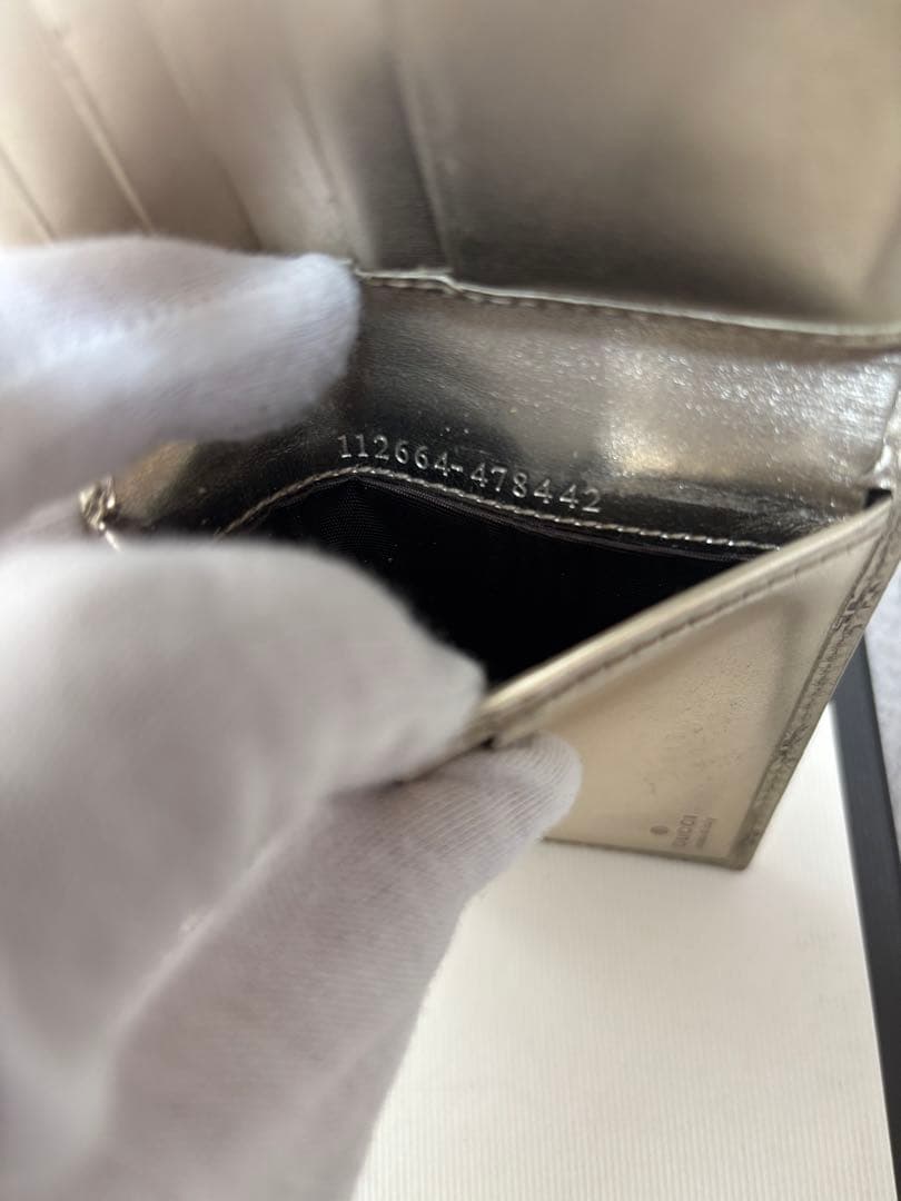 8*様 GUCCI ゴールド　二つ折り財布　グッチ　GGマーク