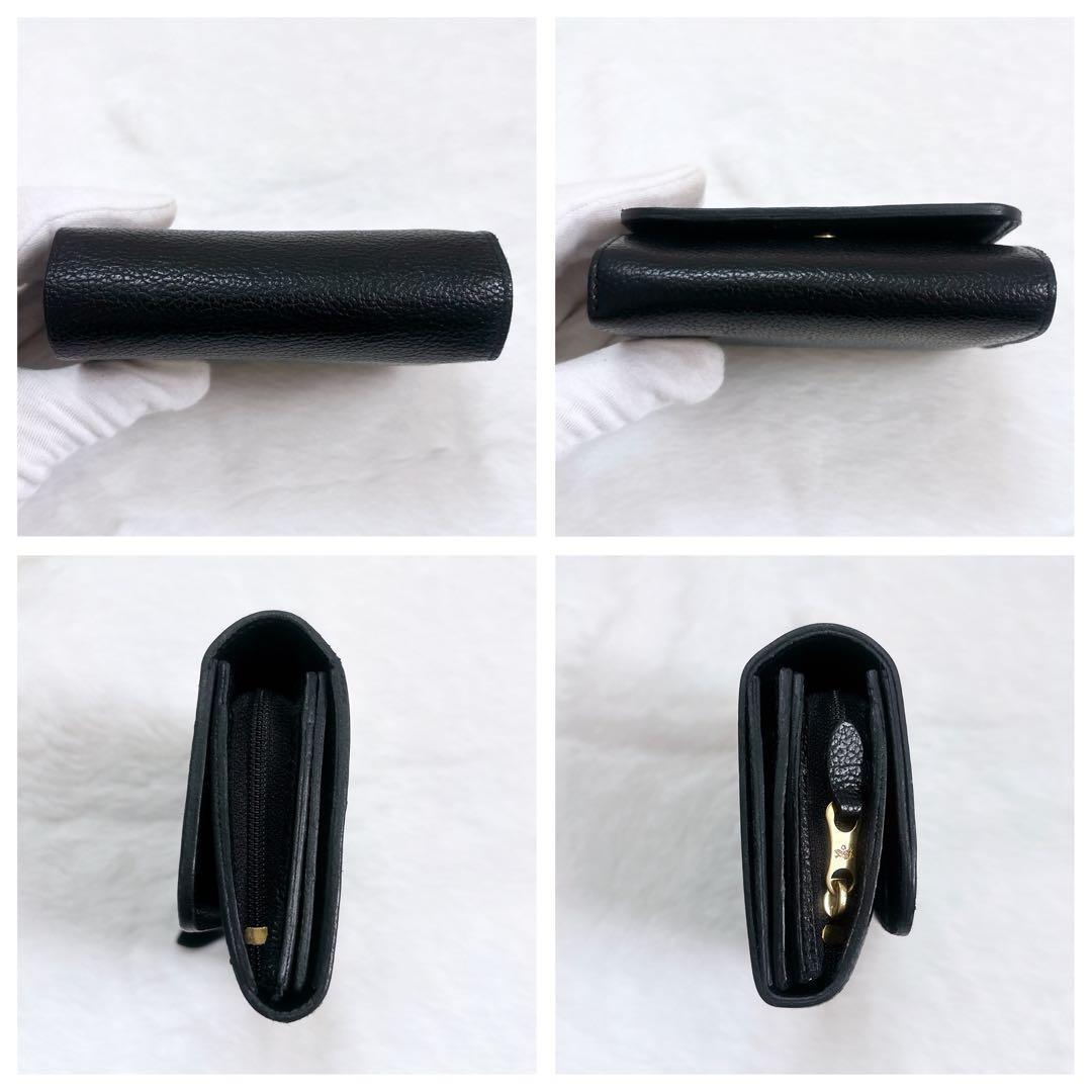 IL BISONTE シュリンクレザー 二つ折り財布 ロゴ刻印 フラップ 黒