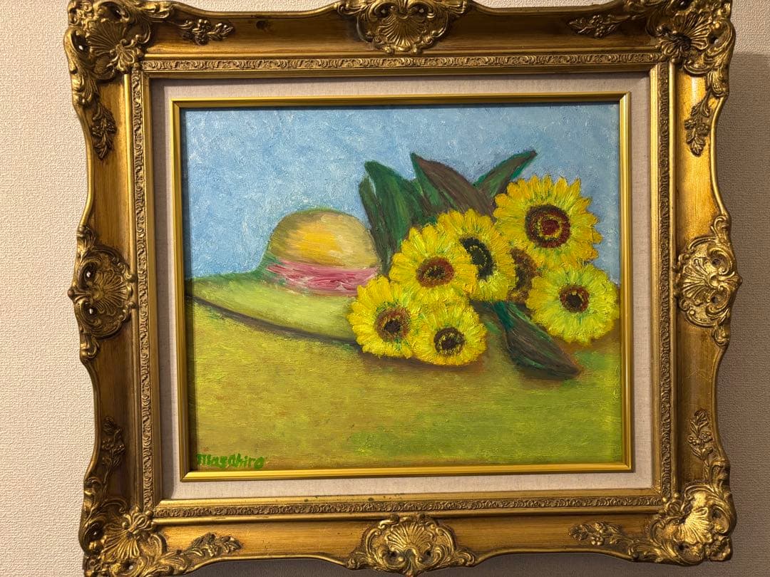 ひまわりと麦わら帽子