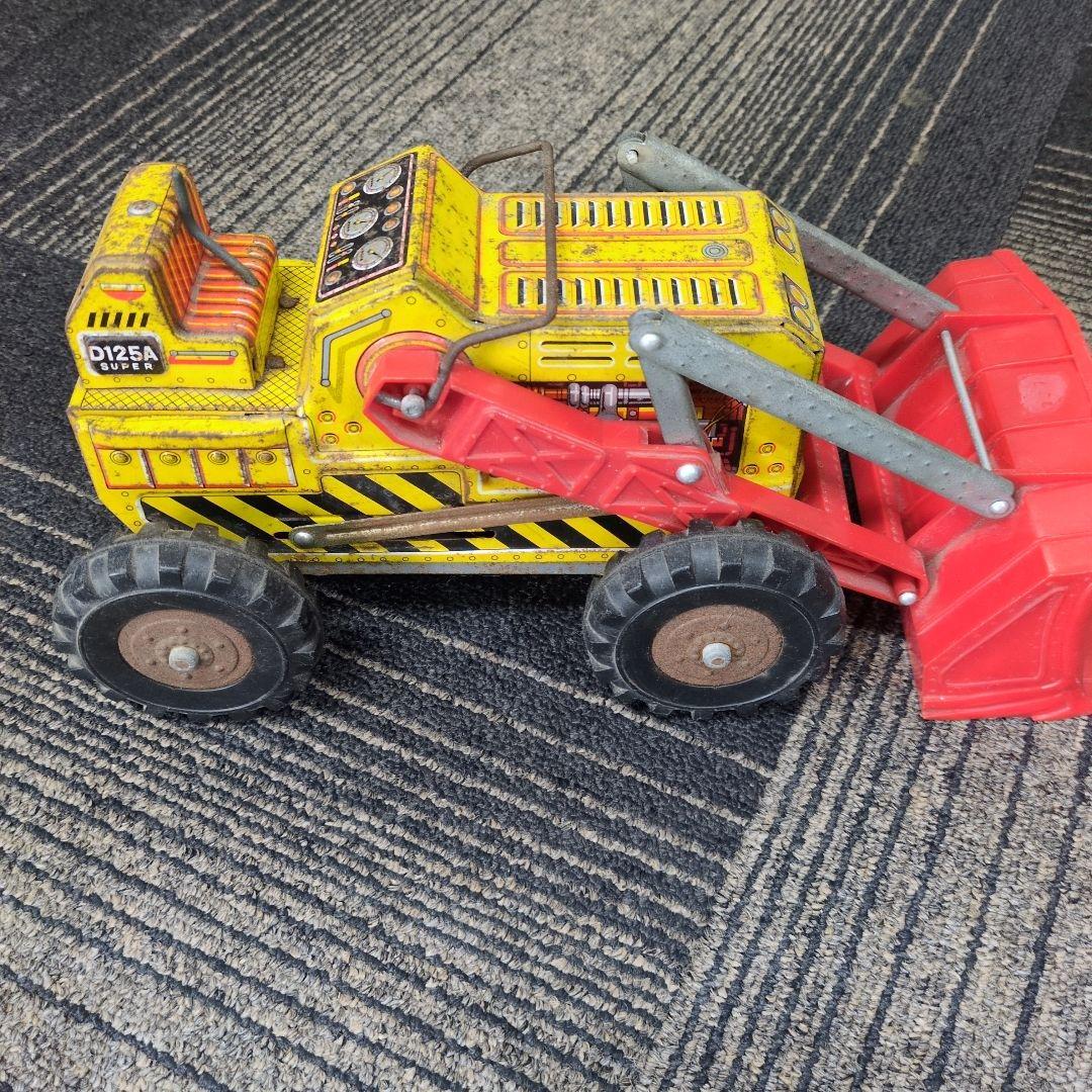 ブリキの 動くショベル付き建設車両
