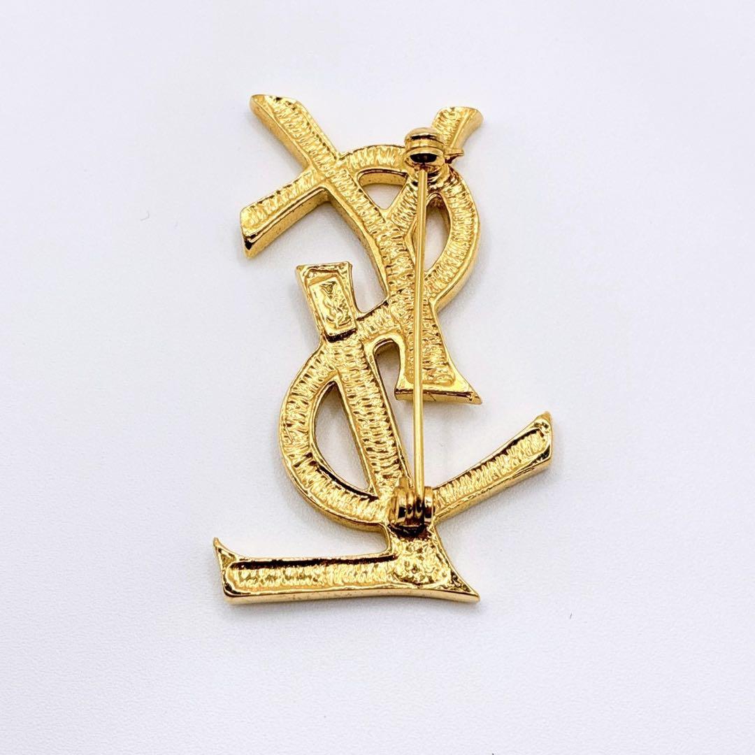 美品✨イヴサンローラン ブローチ カサンドラ ロゴ YSL ゴールド 人気