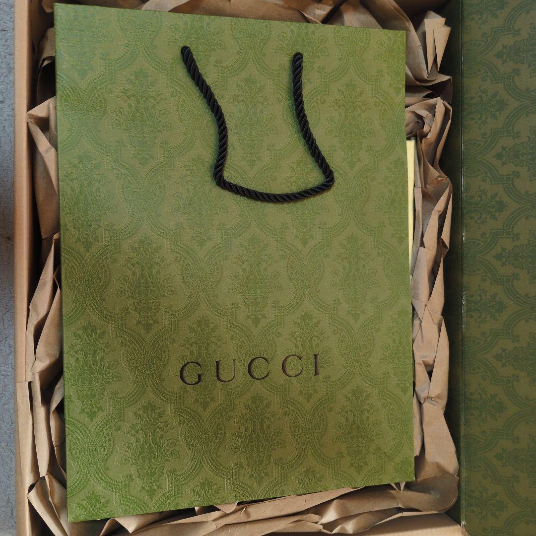 GUCCI ロゴ入りボディスーツ