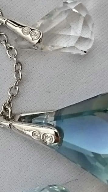 v*v様 購入に責任の持てる方のみSwarovski フープ ドロップアシンメト