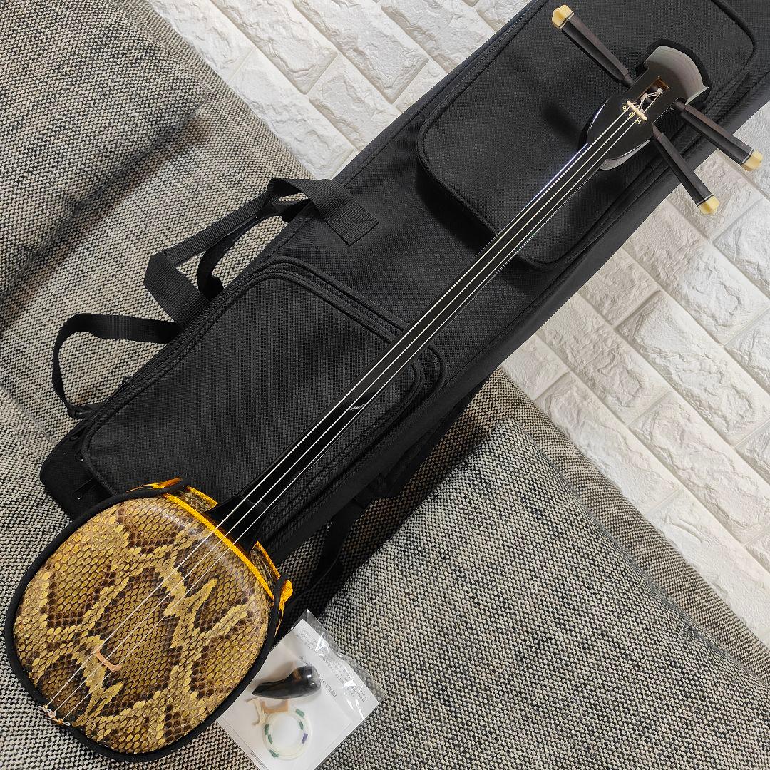 沖縄三線 本蛇革 沖縄音楽館 爪・ケース付き 黒金