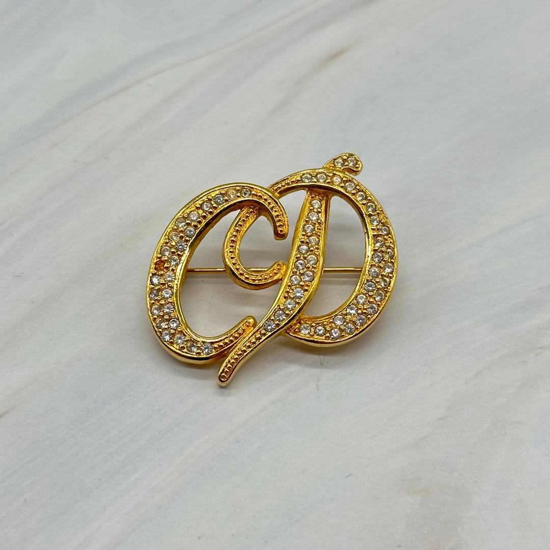 クリスチャンディオール ブローチ CDロゴ ラインストーン ゴールドカラー